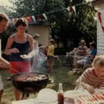 1970s Fourth of July backyard barbecue with family, flags and summer food